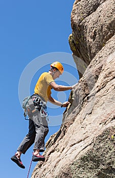 Senior man on steep rock climb in Colorado