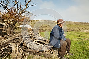 Senior man with stick outdoors