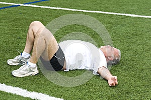 senior man stretching exercising