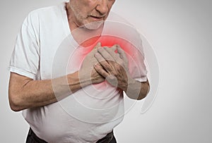 Senior man suffering from bad pain in his chest