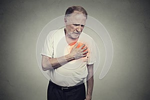 Senior man suffering from bad pain in his chest heart attack