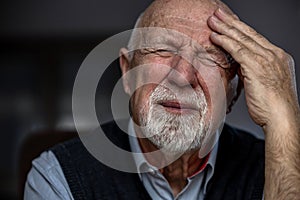 Senior man suffering from a headache