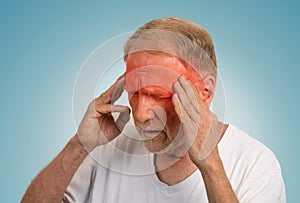 Senior man suffering from headache