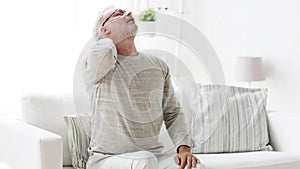 Senior man suffering from headache at home 106