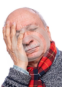 Senior man suffering from headache over white background