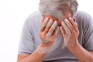 Senior man suffering from headache, stress, migraine photo