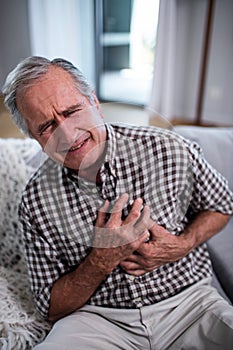 Senior man suffering from heart attack