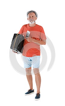 Senior man with suitcase and passport