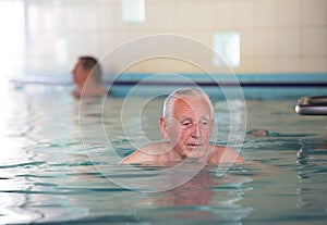 Senior man in swimming pool