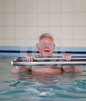 Senior man in swimming pool