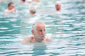 Senior man in swimming pool