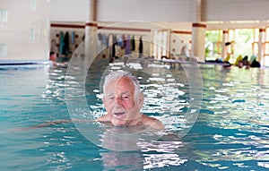 Senior man in swimming pool