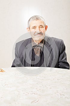 Senior man at table