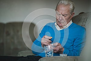 Senior Man Taking Medication