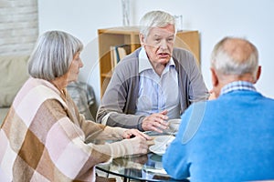 Senior Man Talking to Friends