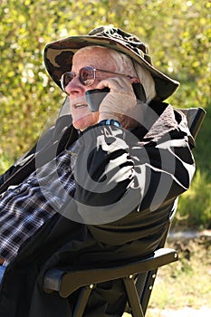 Senior man talks on cell phone