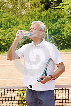 Senior man at tennis court
