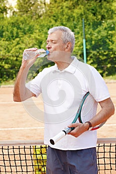 Senior man at tennis court