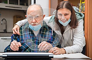 Senior Man with their Caregiver at Home during Coronavirus Pandemia
