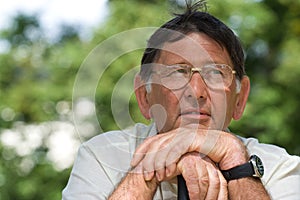 Senior man thoughtful portrait