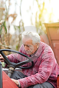 Senior man on tractor