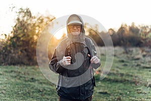 Senior man trail hiking in a mountain forest