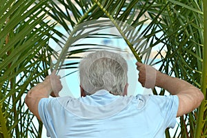 Senior man at tropic resort