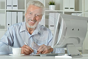 Senior man using computer