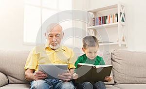 Senior man using digital tablet at home