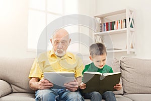 Senior man using digital tablet at home
