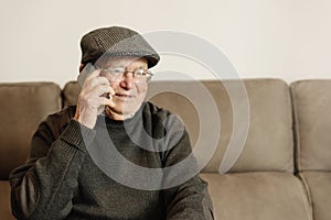 Senior man using his mobile phone.
