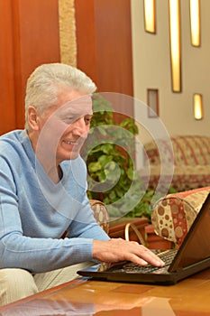 Senior man using laptop