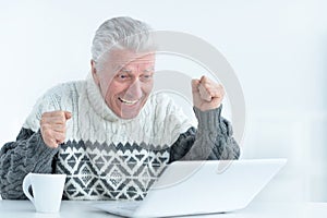 Senior man using laptop