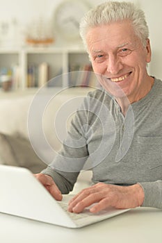 Senior man using laptop