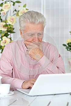 Senior man using laptop