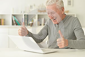 Senior man using laptop