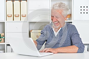 Senior man using laptop