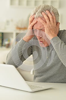 Senior man using laptop