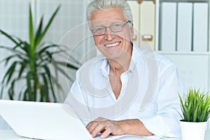 senior man using laptop