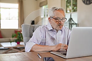 Senior man using laptop