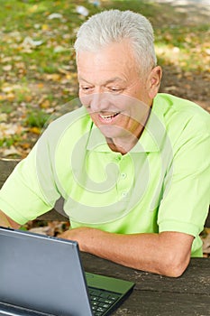 Senior man using laptop