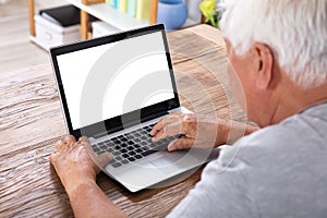 Senior Man Using Laptop