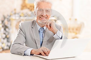 senior man using laptop