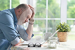 Senior man using laptop