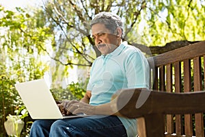 Senior man using laptop