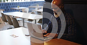 Senior man using laptop in conference room 4k