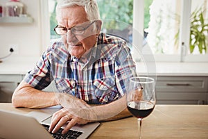 Senior man using laptop