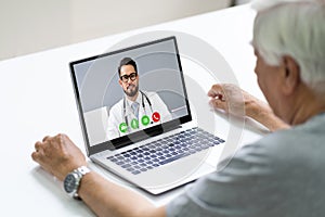 Senior Man In Videochat Or Videoconference With Doctor