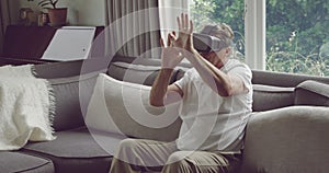 Senior man in VR headset