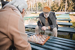 Senior man with walking cane playing